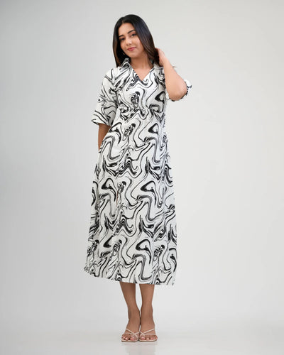 Noirelle white maxi dress, flowing silhouette, worn by a model