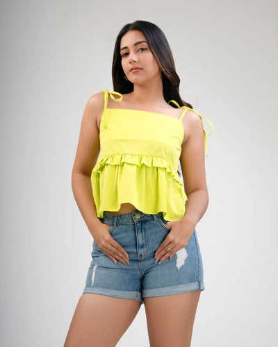 Noirelle bright green crop top, in cotton, worn by a model