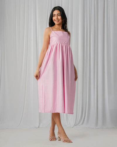 Noirelle pastel pink maxi dress, sleeveless design, worn by a model