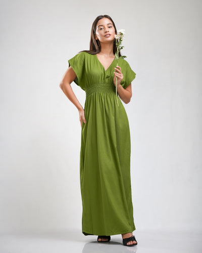 Noirelle olive green maxi dress, smocked waist, worn by a model