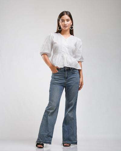 Noirelle white top, puff sleeves, worn by a model