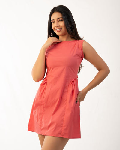 Noirelle peach mini dress, lightweight, feminine silhouette, worn by a model