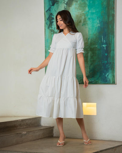 Noirelle ivory midi dress, V-neck wrap bodice, worn by a model