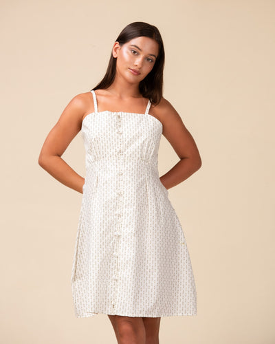 Noirelle white mini dress, delicate print, worn by a model