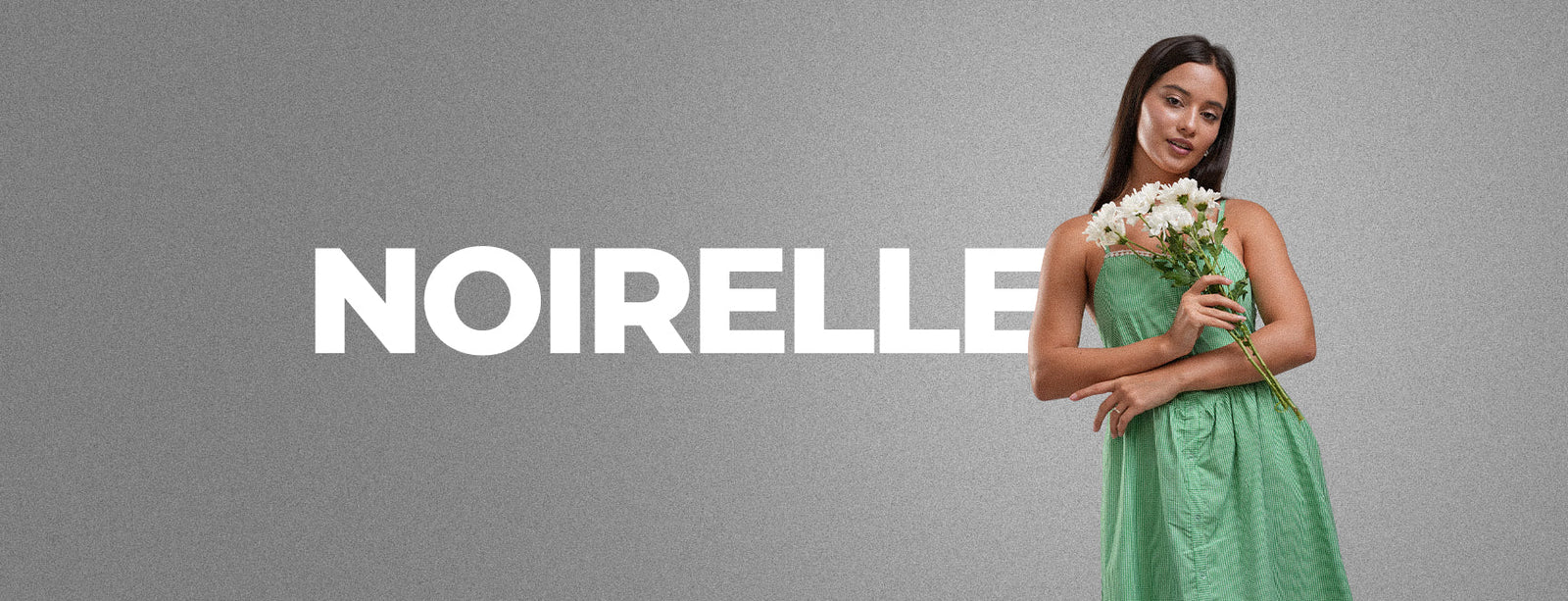 Noirelle brand campaign banner, grey backdrop