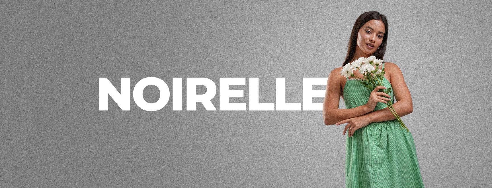 Noirelle brand campaign banner, grey backdrop