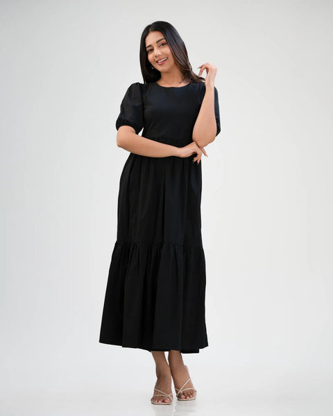 Black tiered maxi dress, front view